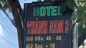 A hotel sign with room rates and amenities. - Thanh Nam Hotel - by Bay Luxury (Ho Chi Minh City)