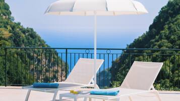 Seasonal outdoor pool, pool umbrellas, pool loungers