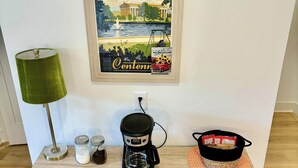 A coffee station with a coffee maker, jars, and mugs on a wooden shelf. - Air-hockey garage game room, 3 queen bedrooms, sleeps 10 — 5 min to BNA, near Opry Mills (Nashvillle)