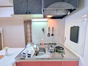 Fridge, microwave, cookware/dishes/utensils, cleaning supplies