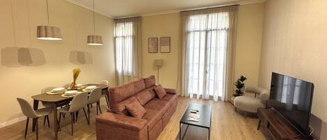 Departamento Deluxe | Área de sala de estar | Televisión