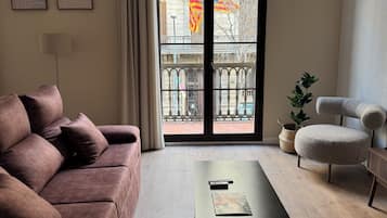 Deluxe Apartment | Living area | TV