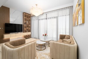 Deluxe Apartment | Living area | 55-inch Smart TV with cable channels - Nasma Luxury Stays - The Cove Building 1 (Dubai)