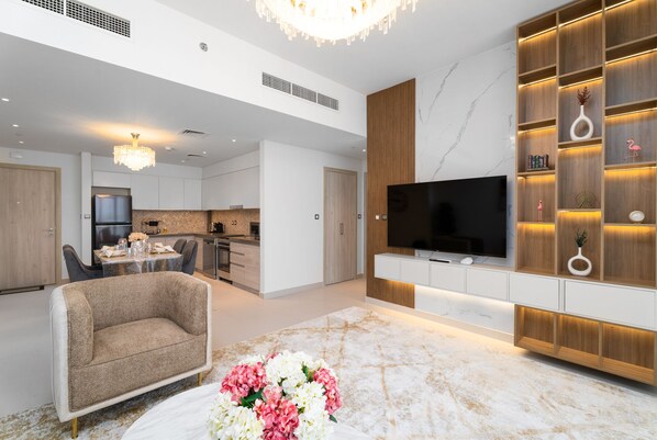 Deluxe Apartment | Living area | 55-inch Smart TV with cable channels - Nasma Luxury Stays - The Cove Building 1 (Dubai)
