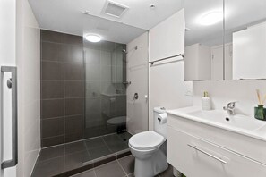 Shower, hair dryer, towels, soap