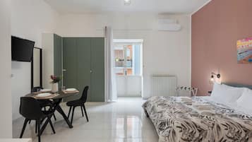 Suite Family | Area soggiorno | TV a schermo piatto