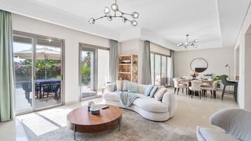 Exclusive Villa | Living area | 55-inch Smart TV with cable channels