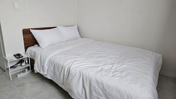 Premium bedding, desk, laptop workspace, soundproofing