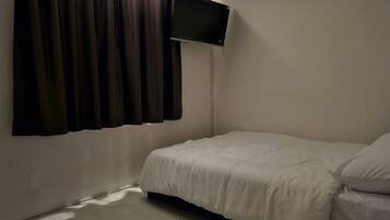 Premium bedding, desk, laptop workspace, soundproofing