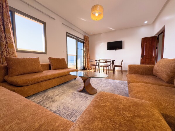Deluxe Apartment, Non Smoking, Beach View | Living area