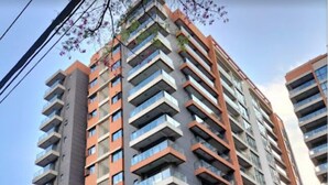 A high-rise residential building with multiple balconies, a modern architectural design, and a clear sky in the background. - Lavington View Palace Apartment  Kenya (Nairobi)