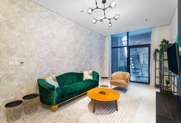 Elite Apartment | Living area | 42-inch Smart TV with cable channels - Nasma Holiday Homes - Marquise Tower (Dubai)