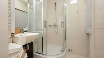 Shower, hair dryer, towels, toilet paper