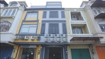 A multi-story building with a storefront at the ground level.