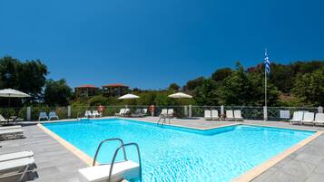 Seasonal outdoor pool, pool umbrellas, pool loungers