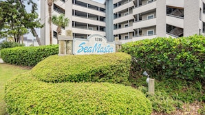 A multi-story building with a sign reading "1310 SeaMaster." - Almost Heaven - Beautiful Oceanfront Condo with a Pool! (Murrells Inlet)