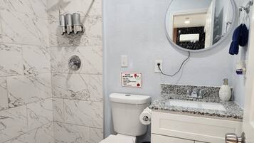 Shower, hair dryer, towels, soap