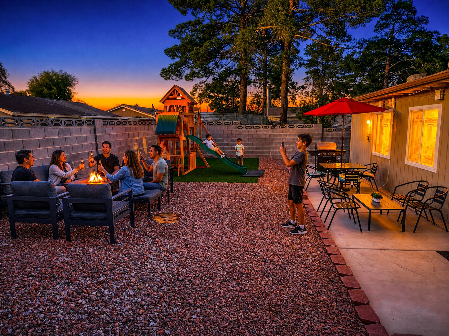 An outdoor patio area with seating, a children's play structure, and a barbecue setup.