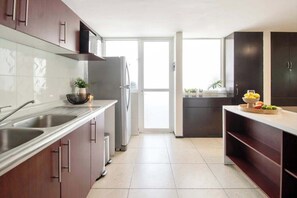 Fridge, microwave, stovetop, coffee/tea maker