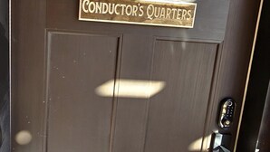 A door with a sign reading "Conductor's Quarters."