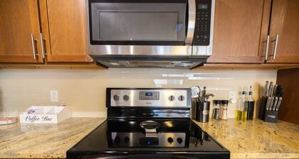 Cozy Retreat with Rooftop Pool, Parking, and Spacious Comfort