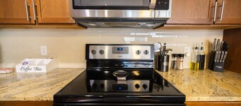 Cozy Retreat with Rooftop Pool, Parking, and Spacious Comfort