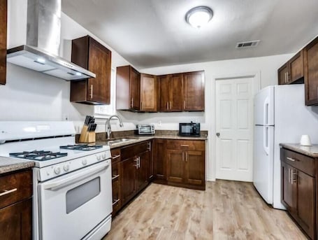 Fridge, microwave, stovetop, coffee/tea maker. Cozy House