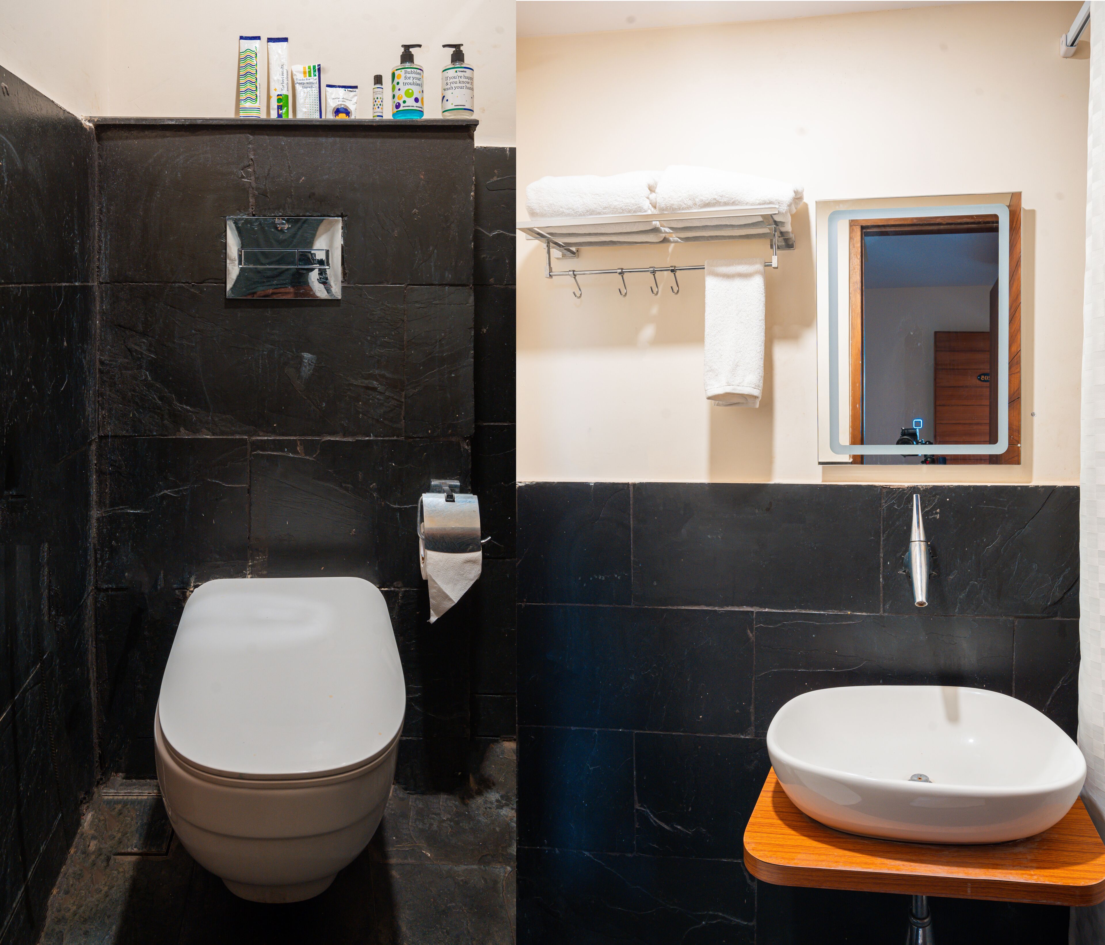 A bathroom with a toilet, a sink, and a mirror.