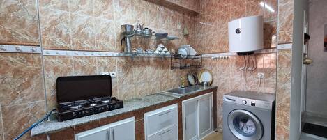 Fridge, microwave, cookware/dishes/utensils