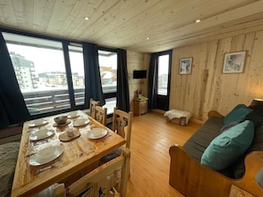 Enjoy a meal at the dining table, relax on the sofa, and take in the view from the large windows.