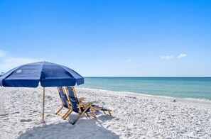 On the beach, sun-loungers, beach towels