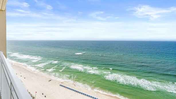 A beach with waves, a clear sky, and a distant horizon. - 2bd 2ba, Sleeps 8, Seasonal Beach Service (Panama City Beach)