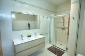 Shower, hair dryer, towels, toilet paper