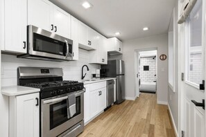 Fridge, microwave, oven, stovetop - Renovated Baltimore Home | Walk to Little Italy & Fells Point (Baltimore)