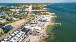 A coastal hotel with multiple buildings, a marina, and a beach. - Salty Breezes Condo 2bed 2bath second floor with elevator, pool & ocean front! (Key Colony Beach)