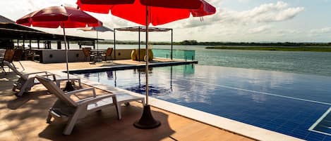 Indoor pool, open 9:00 AM to 6:00 PM, pool umbrellas, sun loungers