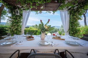 Enjoy a meal al fresco at this beautifully set outdoor dining area.