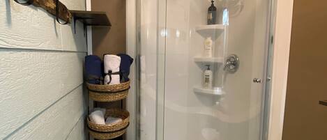 Shower, hair dryer, towels, soap