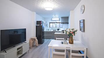 Deluxe Villa | Living area | Flat-screen TV