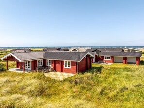 Cabins offer a serene view of the sea from their porches.
