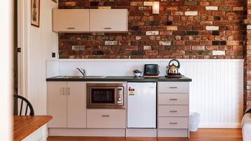 Microwave, coffee/tea maker, toaster, cookware/dishes/utensils