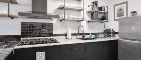 Fridge, microwave, stovetop, coffee/tea maker