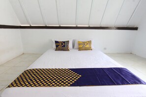 Laptop workspace, bed sheets