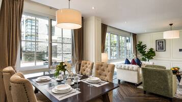 Elite Apartment, 2 Bedrooms, City View, Poolside | Living area | 40-inch LED TV with digital channels