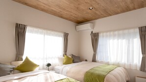 A hotel room with two beds, a wooden ceiling, an air conditioning unit, and large windows with curtains. - SMART VILLA Hakone Sukumogawa Riverside (Hakone)