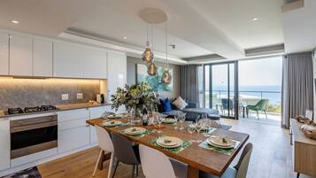 Apartment, 4 Bedrooms | Living area | Flat-screen TV