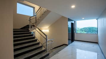 Executive Studio Suite | Living area | 32-inch LED TV with satellite channels