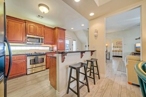 Fridge, microwave, oven, stovetop - Walk to the Beach | Golf Cart Rental, Beach Boardwalk, Balcony Views | AvantStay (Port Aransas)