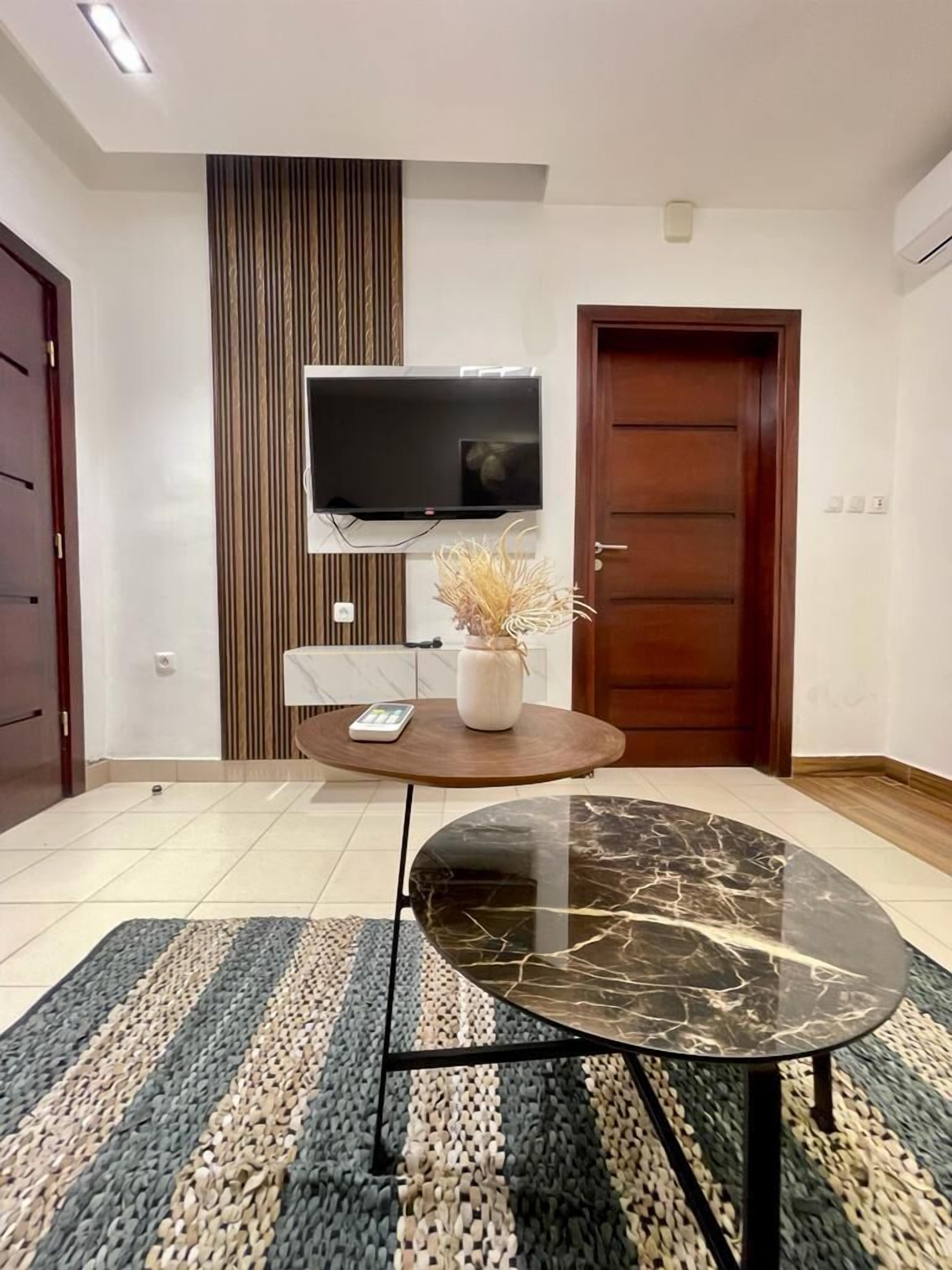 Standard Apartment | Living area | 42-inch Smart TV with cable channels