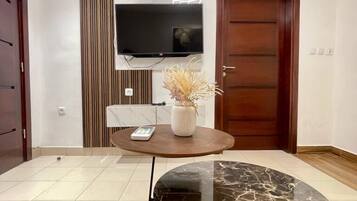 Standard Apartment | Living area | 42-inch Smart TV with cable channels